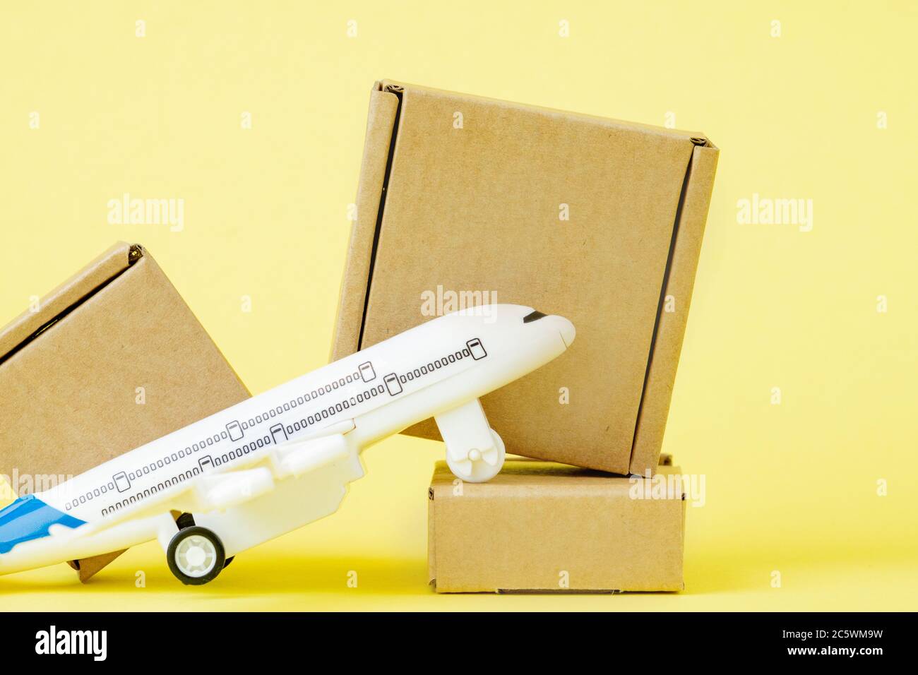 Airplane and stack of cardboard boxes. concept of air cargo and parcels