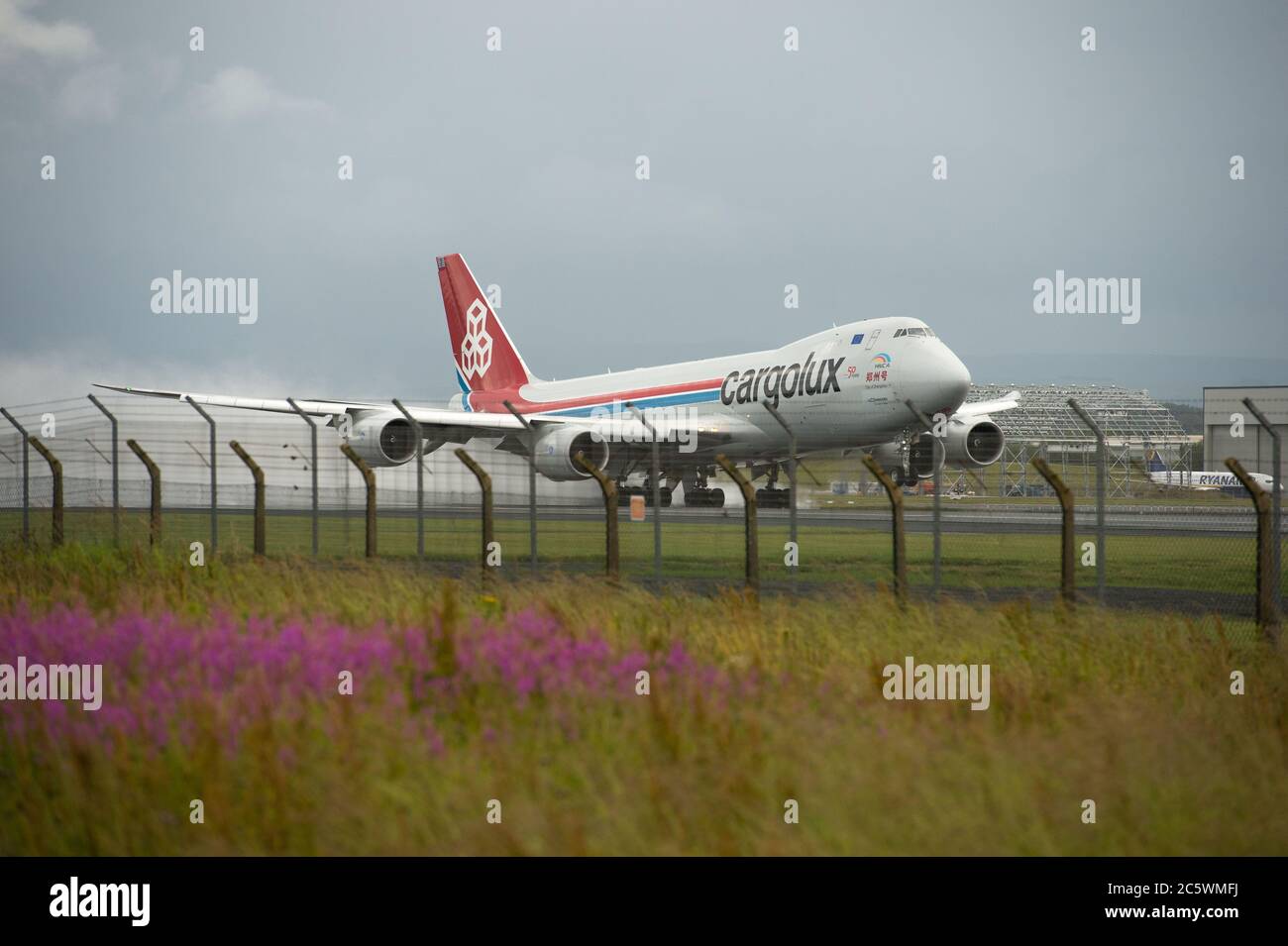 Prestwick, Scotland, UK. 5th July, 2020. Pictured: Cargolux Boeing 747-8R7F Jumbo Jet Air Freighter (reg LX-VCJ) seen taking off on a very wet and windy runway from Glasgow Prestwick International Airport bound for Luxembourg with a payload of air freight. Credit: Colin Fisher/Alamy Live News Stock Photo