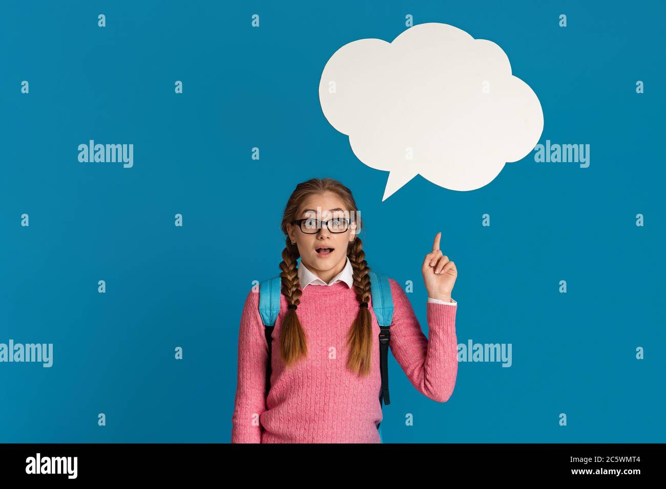 Girl points to abstract cloud for thoughts Stock Photo