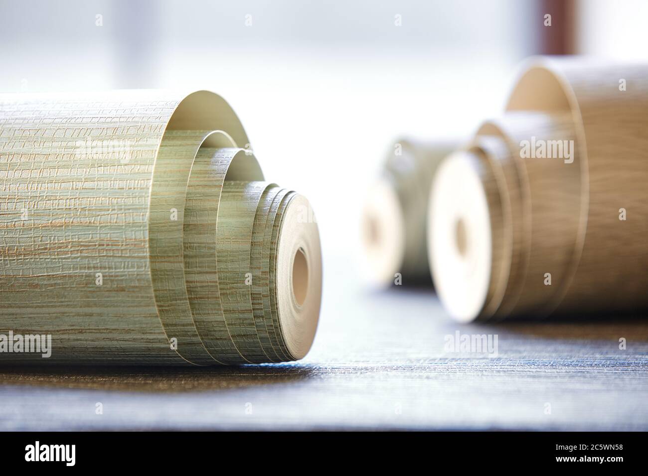 Close-up of variety of wallpaper rolls on floor in a store Stock Photo