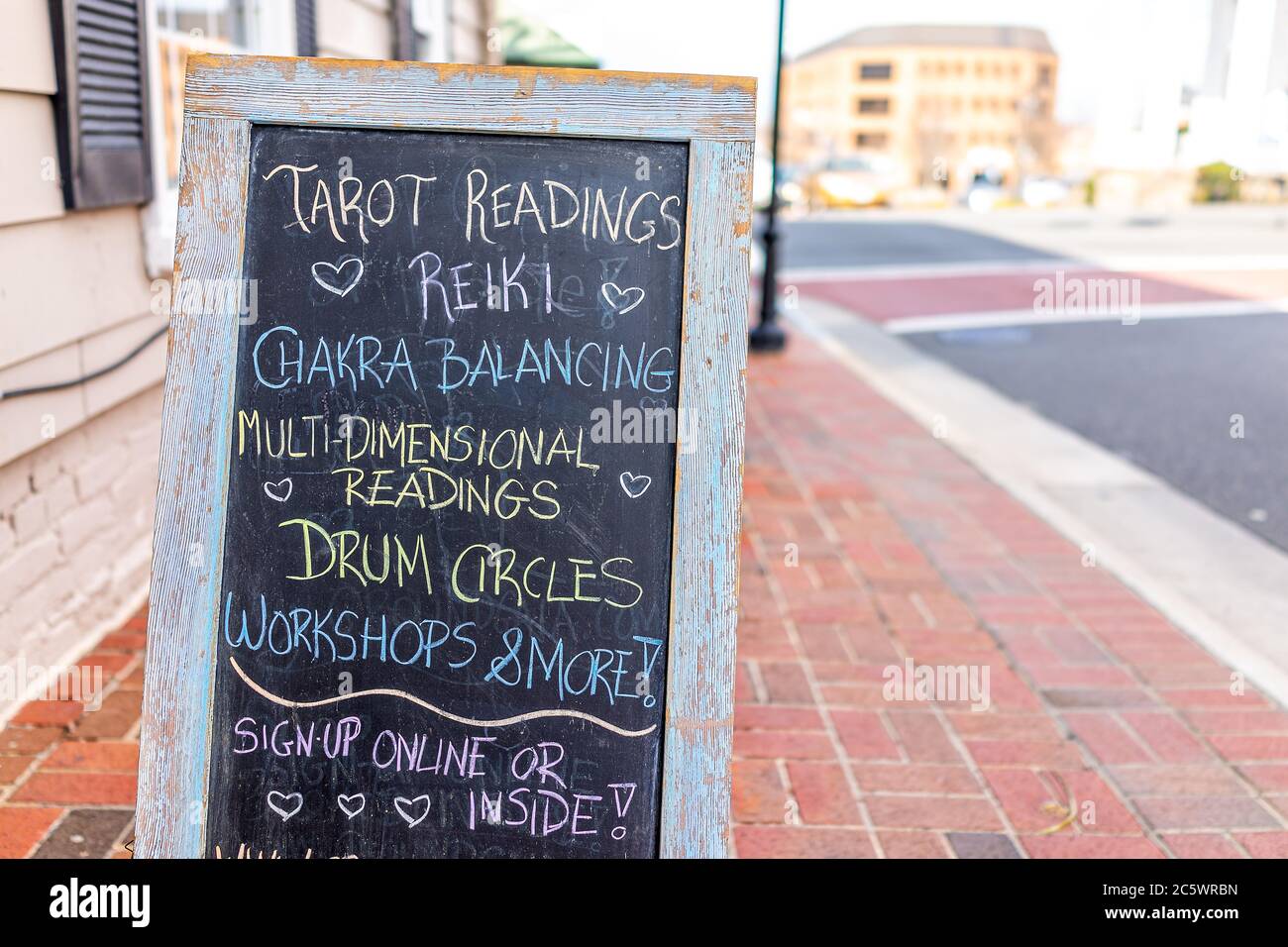 City of Fairfax, USA - March 10, 2020: Old town downtown Main street with store shop placard sign for tarot readings in Fairfax county northern Virgin Stock Photo