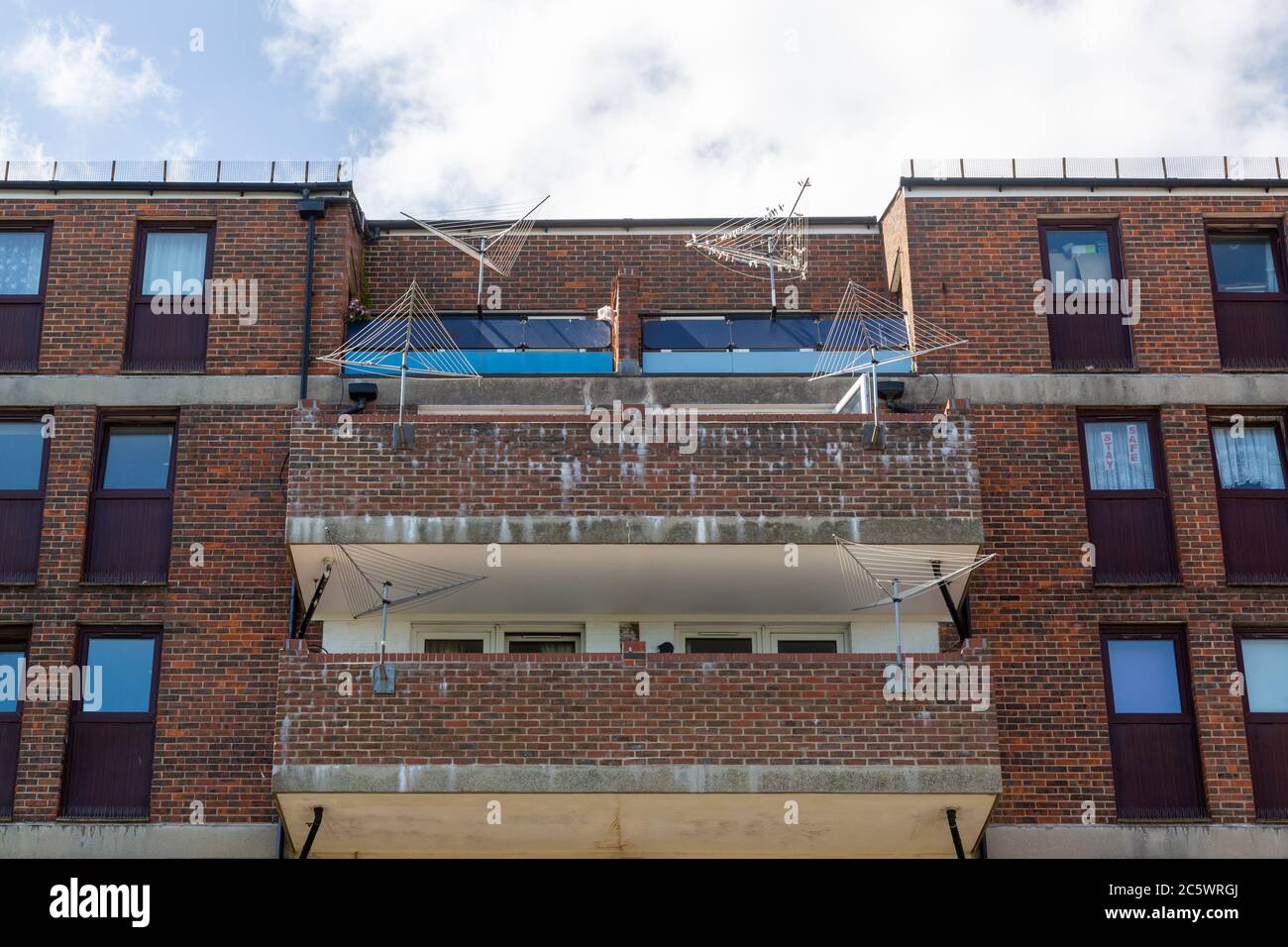 council flat balconies with empty washing lines typical English council housing Stock Photo