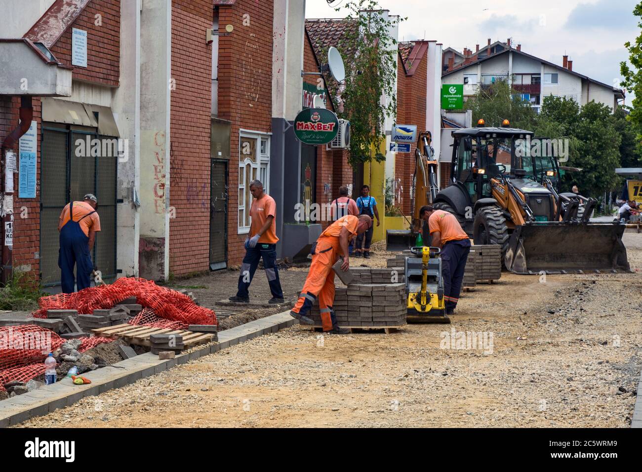 Zrenjanin, Serbia, July 04, 2020. Works on the installation of a new sidewalk in the settlement of Bagljas in the town of Zrenjanin. Works are current Stock Photo