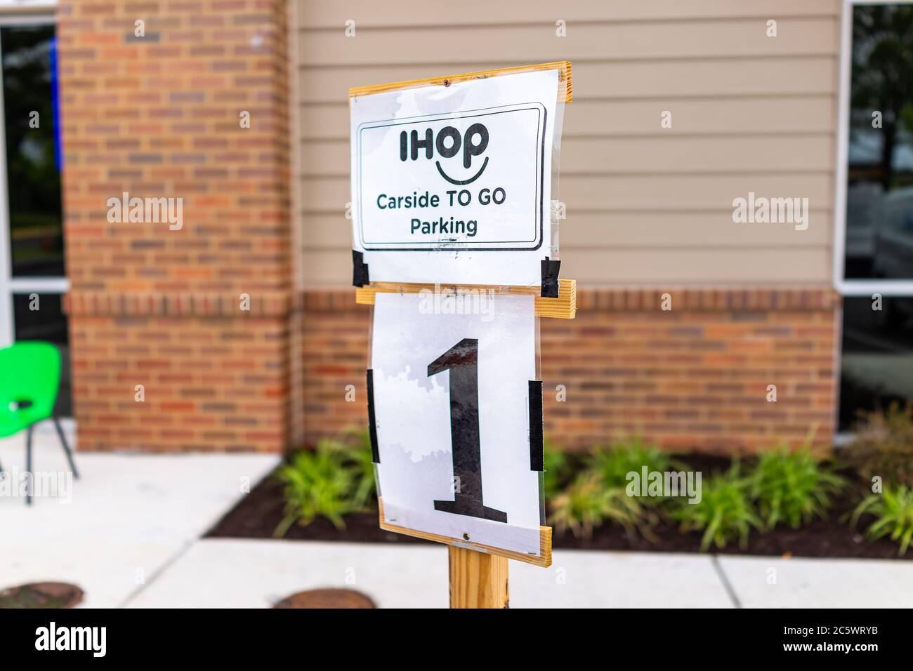 Herndon, USA - June 11, 2020: Virginia Fairfax County closeup of parking spot sign for open ihop restaurant for take-out and delivery during coronavir Stock Photo