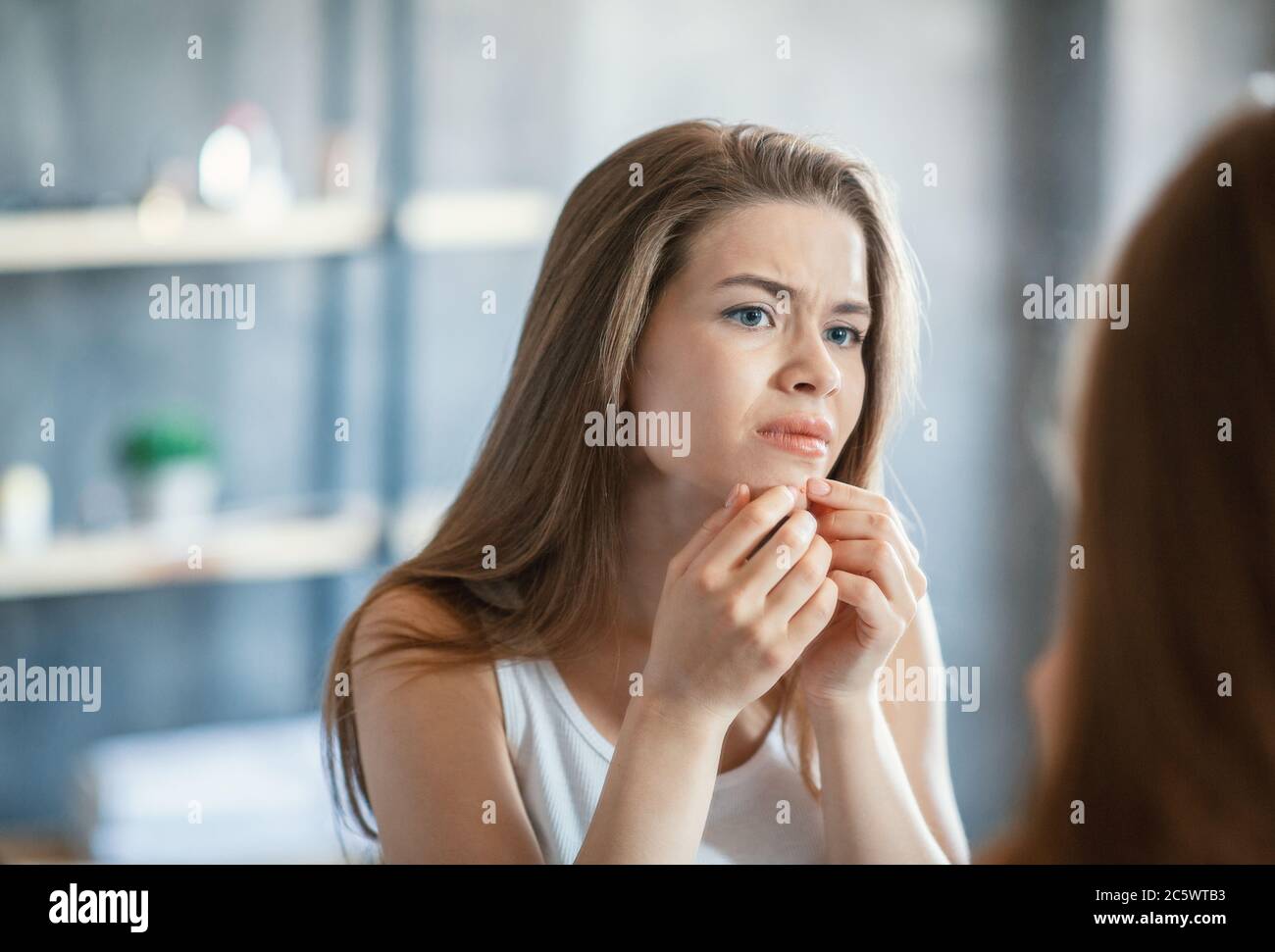 The young woman is looking sad on the pink background. Stock Photo by  ©vova130555@gmail.com 186125244