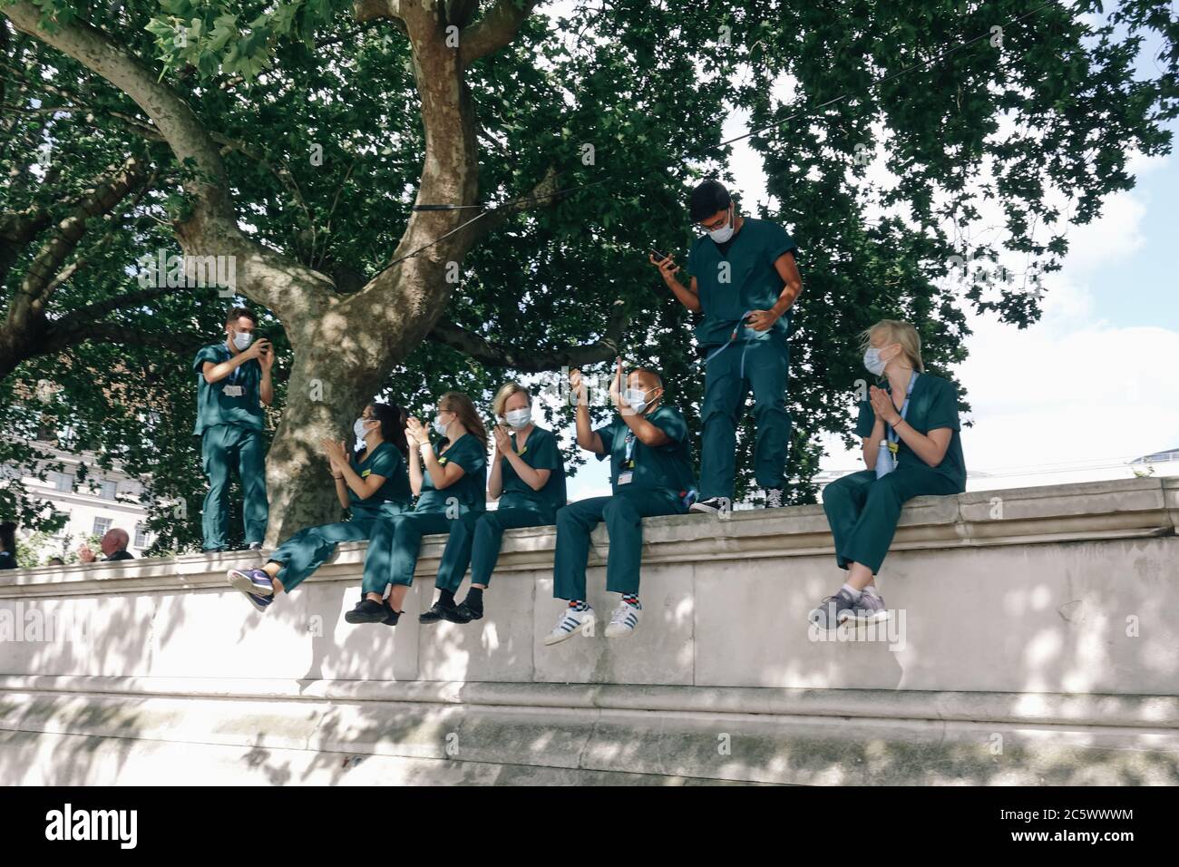 5th July 2020, NHS Staff gather outside St Thomas' Hospital in London to Clap for Carers on the 72nd Anniversary of the NHS. Stock Photo