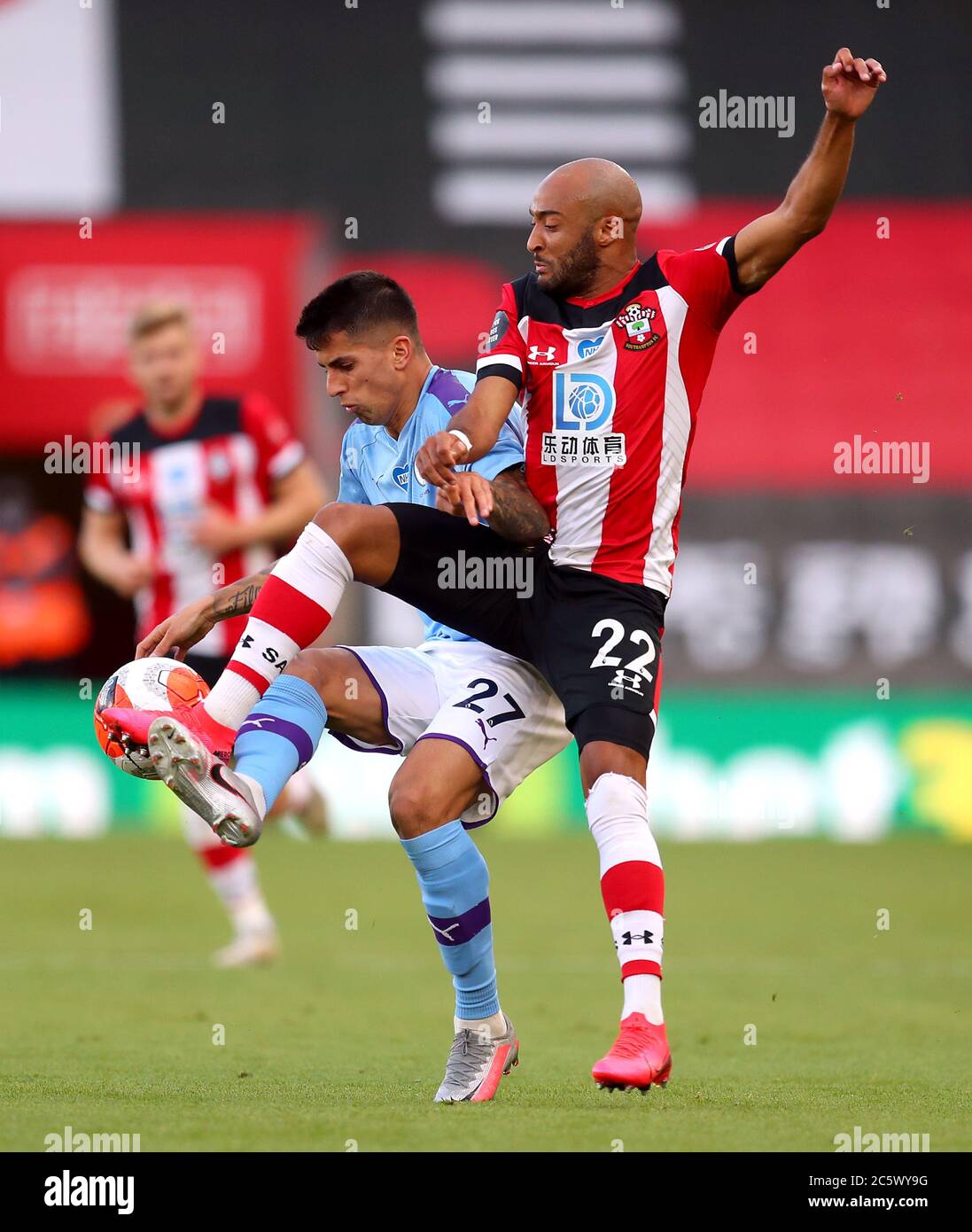 Southampton's Nathan Redmond (right) and Manchester City's Joao Cancelo battle for the ball during the Premier League match at St Mary's Stadium, Southampton. Stock Photo