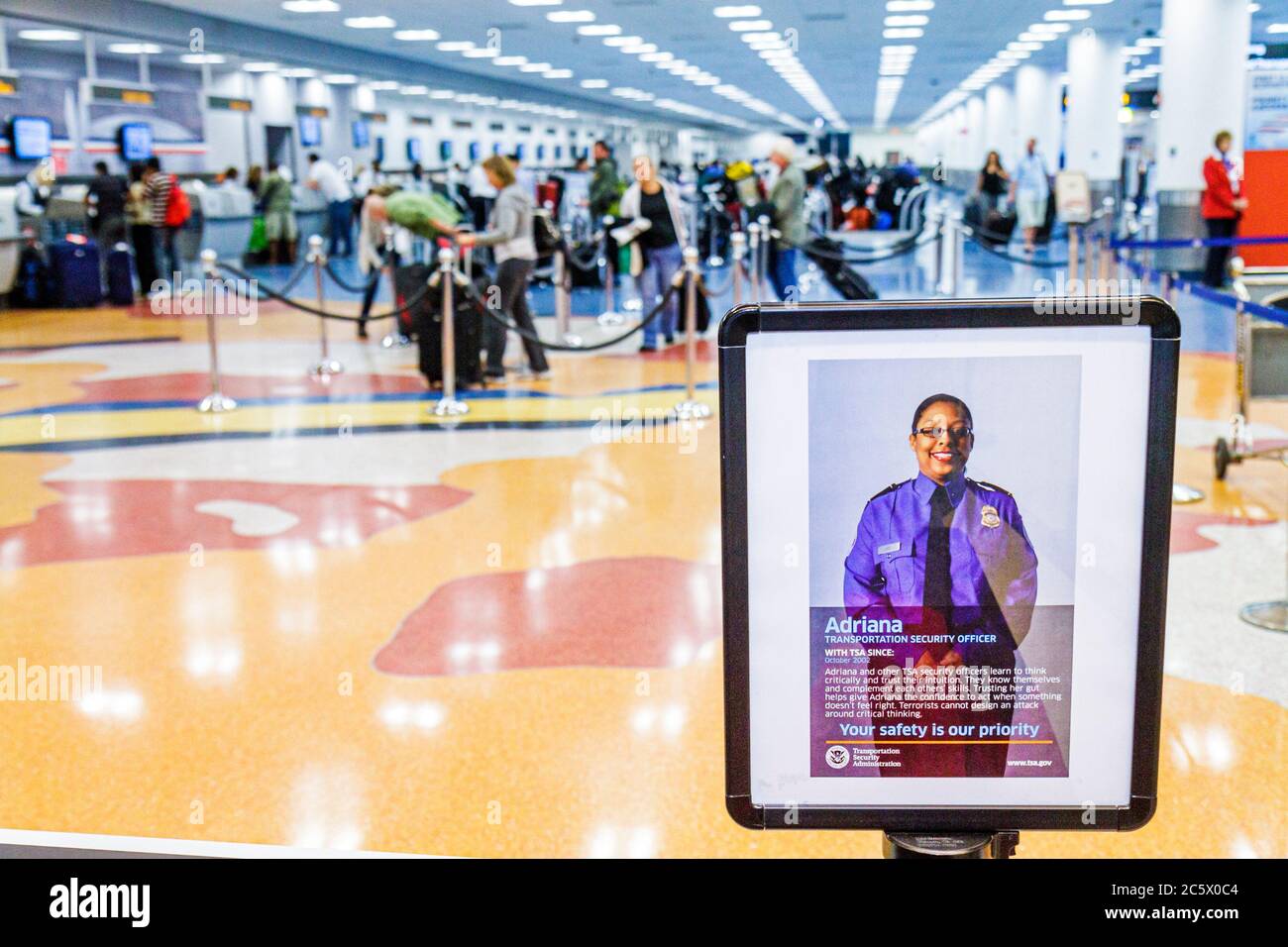 Miami Florida International Airport MIA,aviation,terminal,sign,Black woman female women adult adults,TSA,Transportation Security Administration,safety Stock Photo