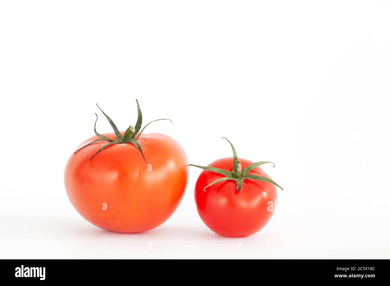 fresh red tomatoes isolated on white background Stock Photo - Alamy