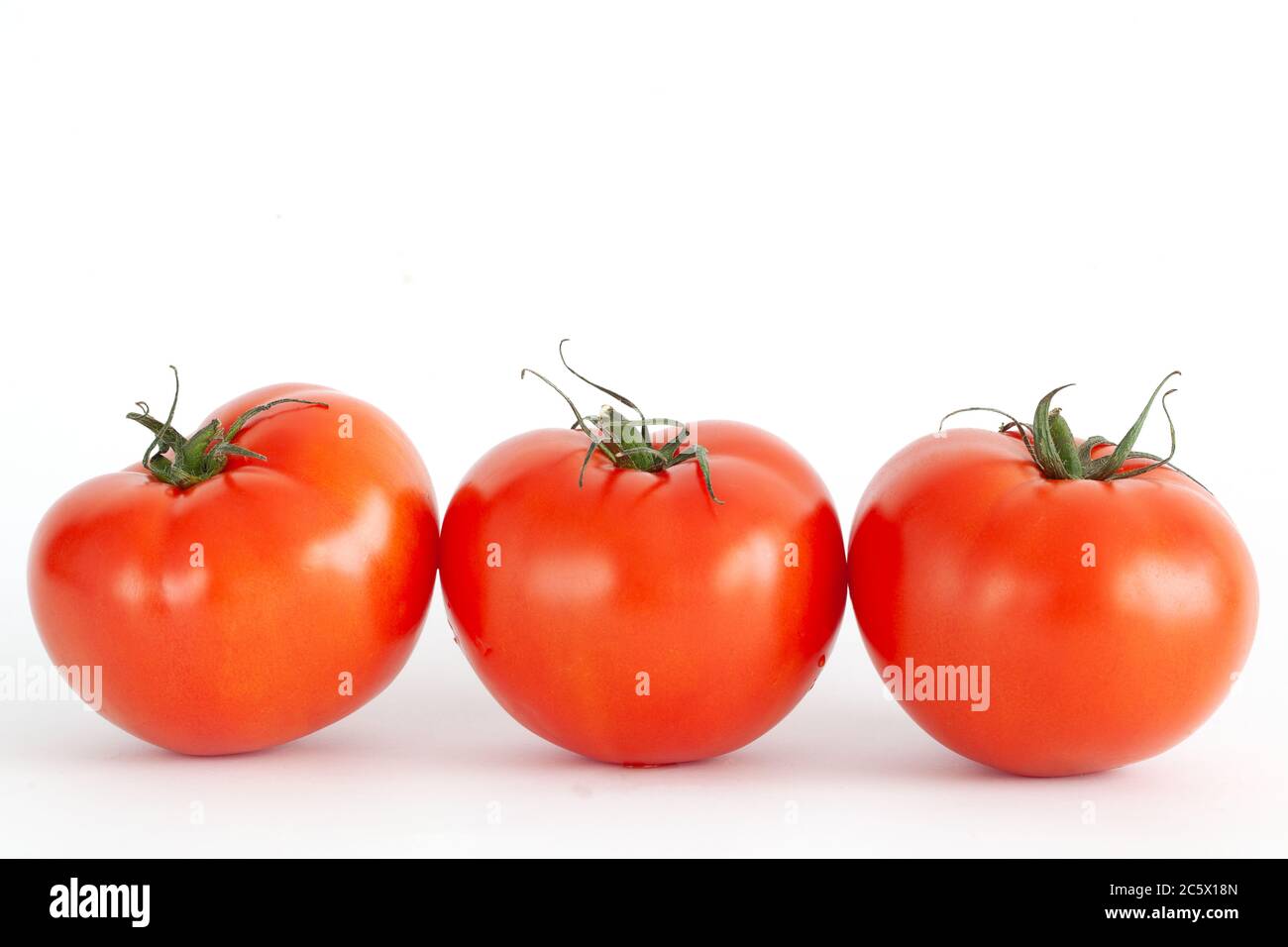 fresh red tomatoes isolated on white background Stock Photo - Alamy