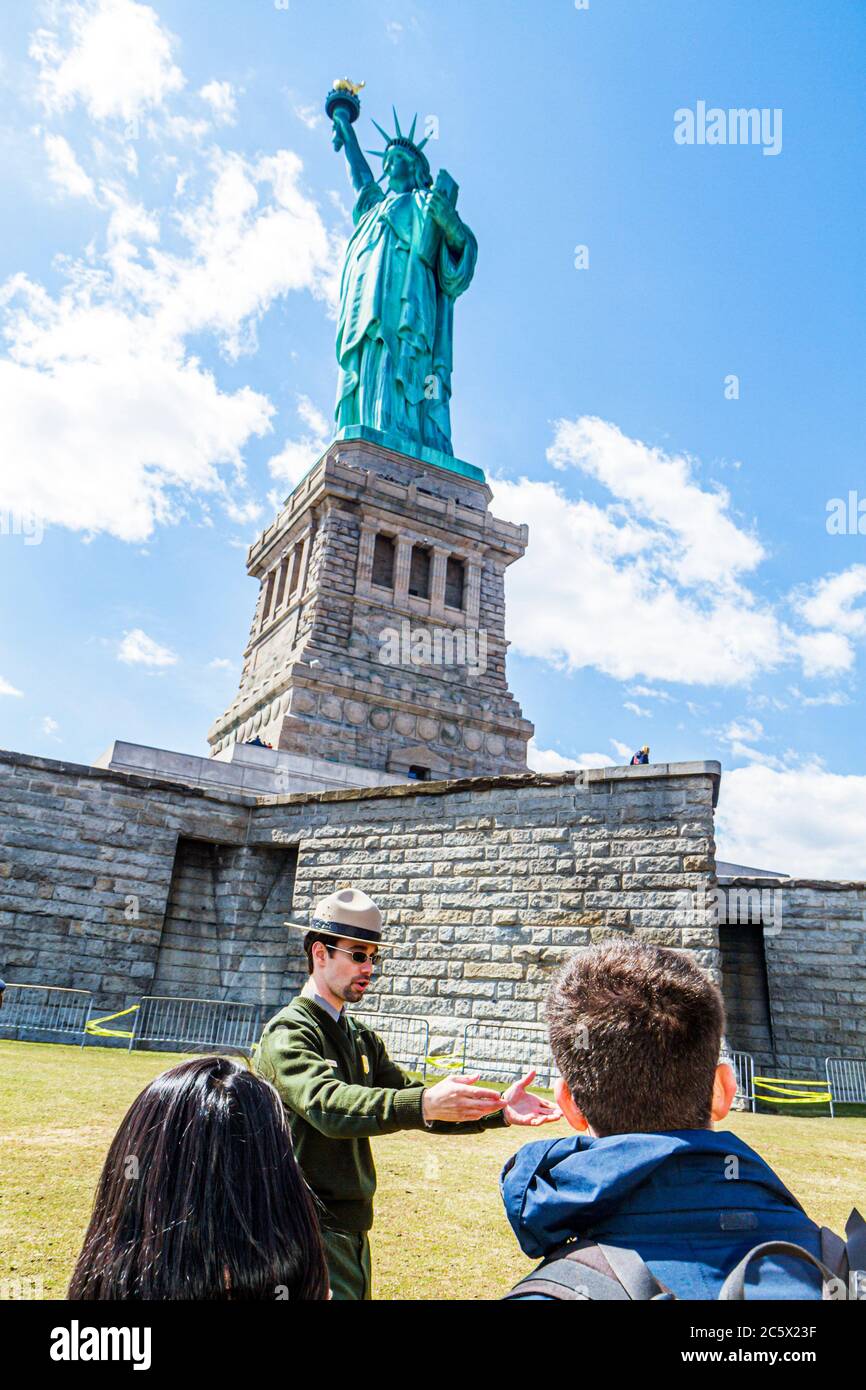 New York City,NYC NY Upper Bay,Statue Cruises,Statue of Liberty National Monument,Liberty Island,freedom,symbol,Bartholdi,sculptor,torch,tablet,pedest Stock Photo