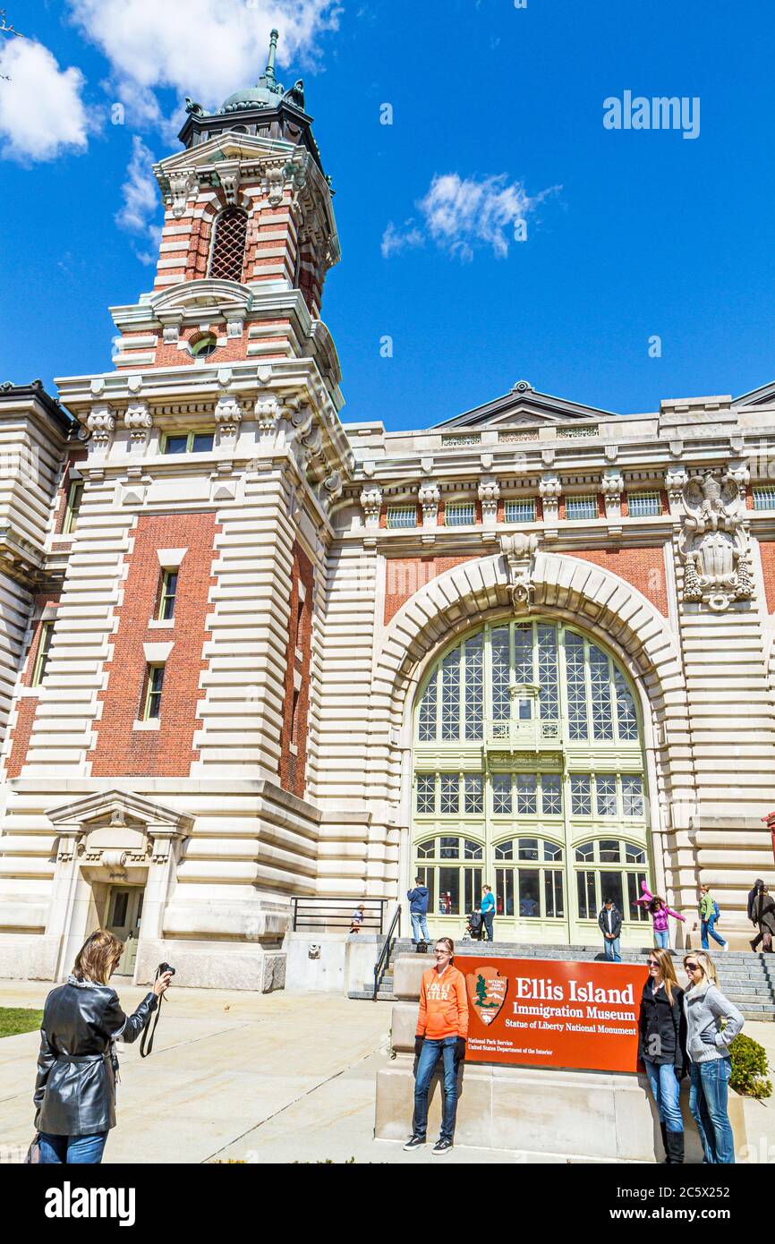 New York,New York City,NYC,Statue of Liberty National Monument,Ellis Island Immigration Museum,historic building,outside exterior front,entrance,woman Stock Photo