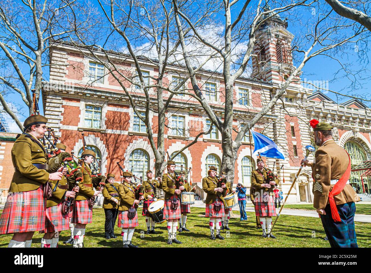 New York City,NYC NY Statue of Liberty National Monument,Ellis Island Immigration Museum,historic building,outside exterior,front,entrance,Scots Guard Stock Photo