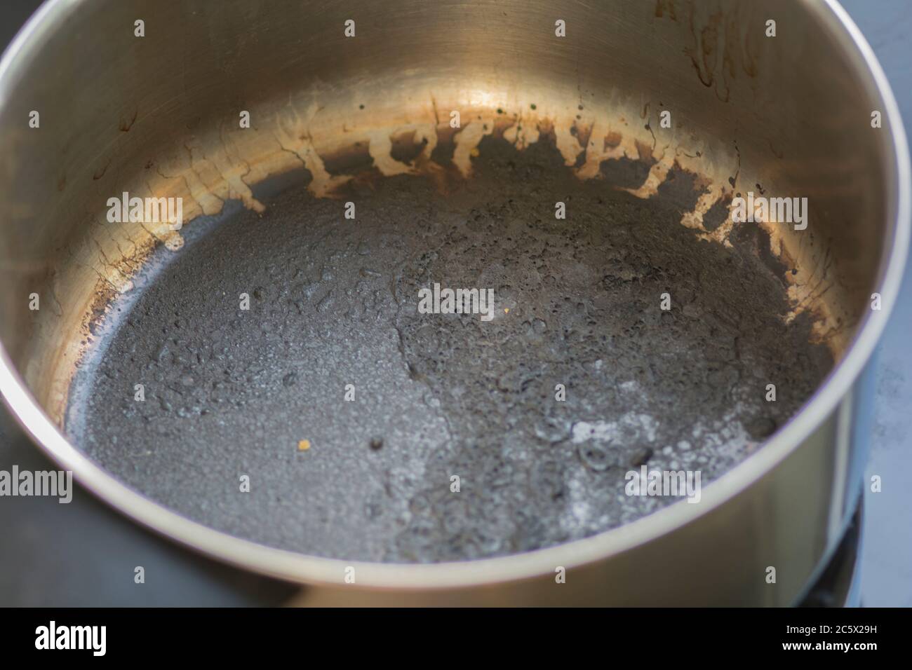 Empty burnt pot with black bottom Stock Photo Alamy