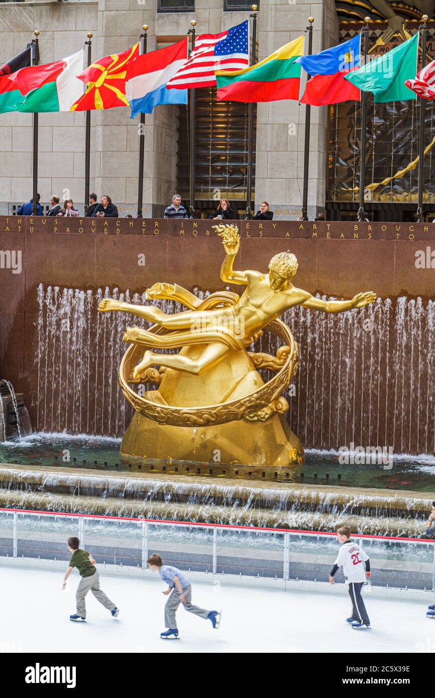 New York,New York City,NYC,Midtown,Manhattan,5th Fifth Avenue,Rockefeller Center,Plaza,fountain,Prometheus,gilded statue,Paul Manship,sculptor,ice ska Stock Photo
