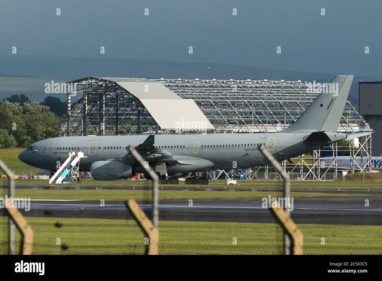 Prestwick, Scotland, UK. 5th July, 2020. Pictured: Royal Air Force (R.A.F) Voyager Aircraft (Reg ZZ343), which is an Air Refueling Transport for the RAF, seen at Glasgow Prestwick International Airport after just landing. Seen on the tarmac outside of the Ryanair hangar with airstrips positioned beside the plane. Credit: Colin Fisher/Alamy Live News Stock Photo