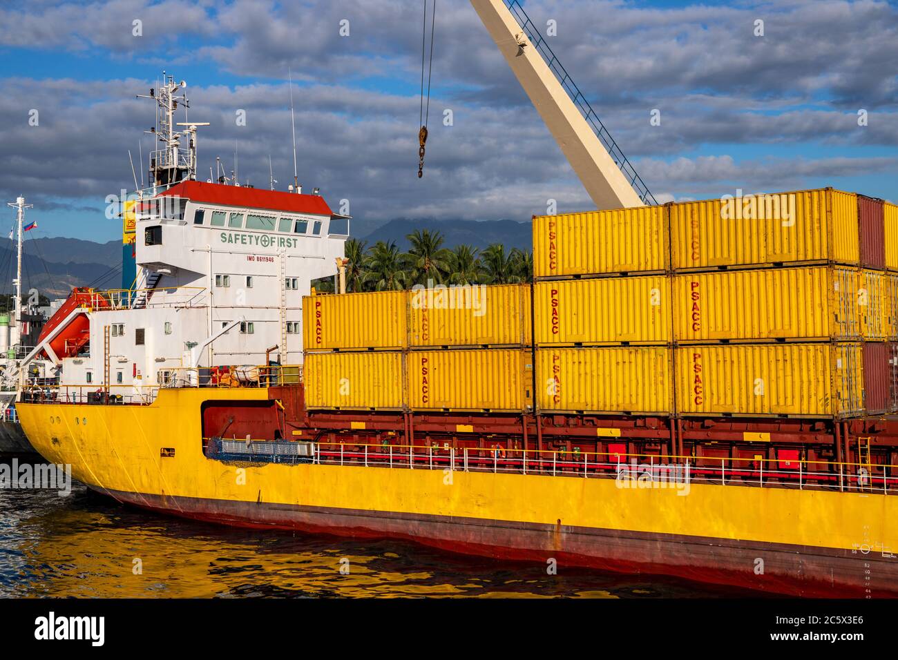 Dumaguete, the Philippines 10 Mar 2020 yellow cargo ship in port