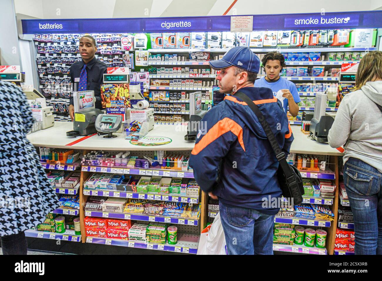 New York City,NY NYC Midtown,Manhattan,Times Square,Walgreens,company,pharmacy,drug store,cashier,Black man men male adult adults,working,work,employe Stock Photo