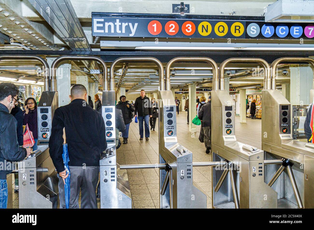 New York City,NYC NY Manhattan,Midtown,MTA,New York City,Subway system,Times Square Station,A C E N R Q S 1 2 3 7 highway Route,commuter,commuters,tur Stock Photo