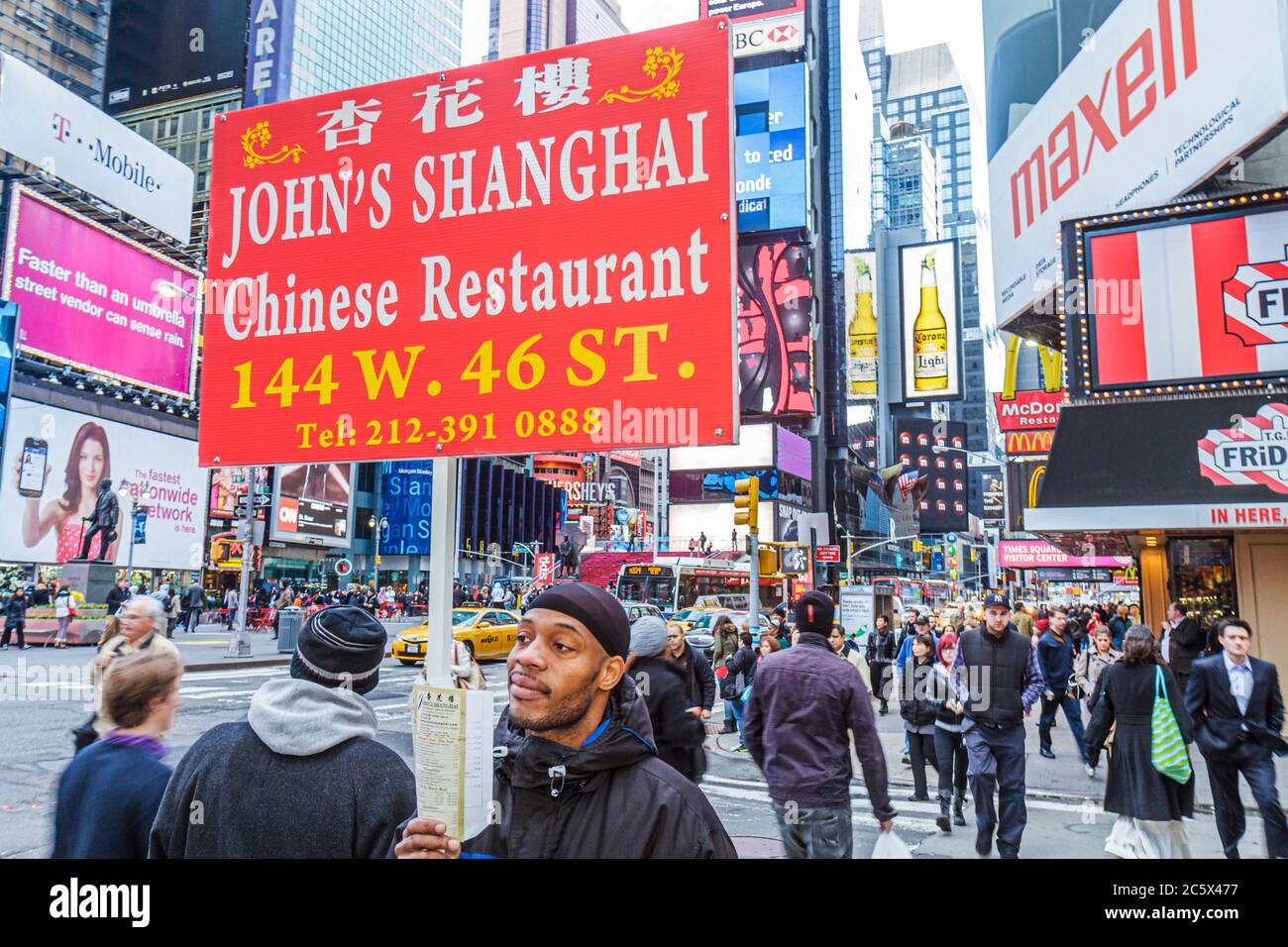 New York City,NY NYC Manhattan,Midtown,Times Square,Black minorities,man men male adult adults,working,work,employee worker workers staff,holding sign Stock Photo