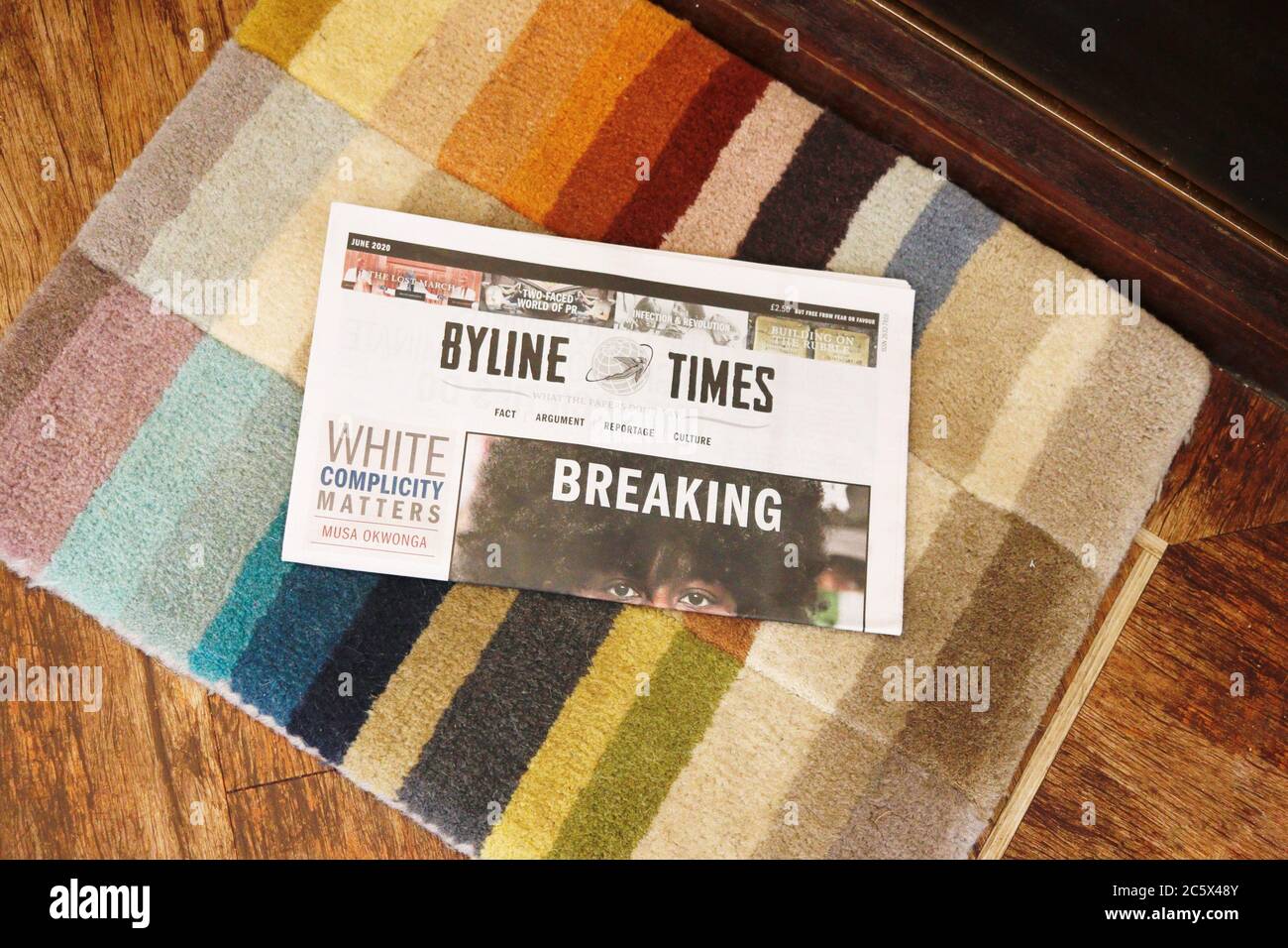 A new copy of the Byline Times, the independent newspaper, lands on the doormat. Stock Photo