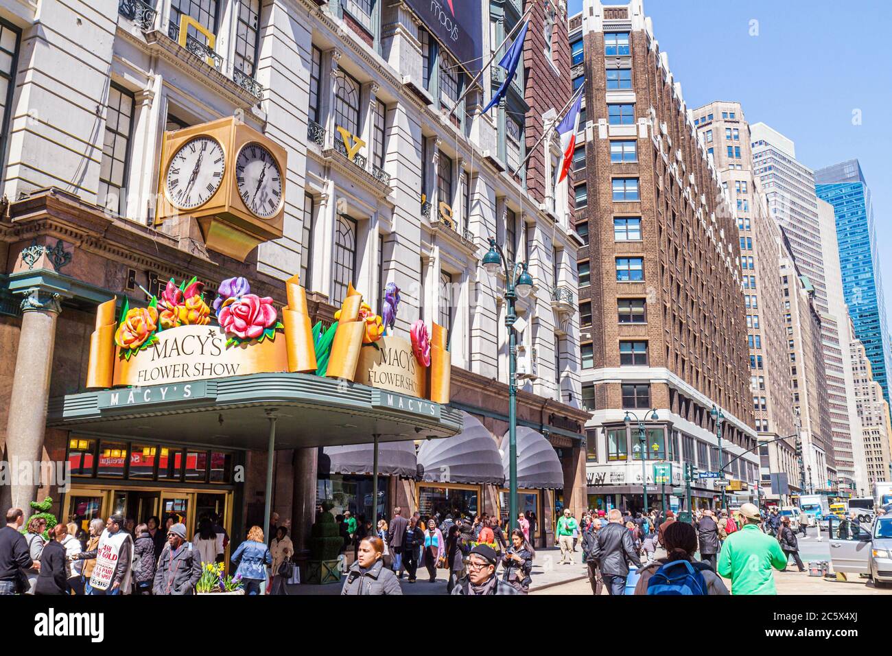New York City,NYC NY Manhattan,Midtown,34th Street,Macy's,retail chain,Herald Square,department store,building,outside exterior,front,entrance,Flower Stock Photo