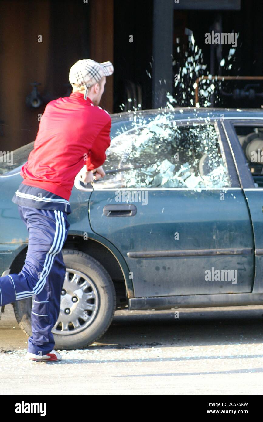 street riot, criminal damage to motor vehicle Stock Photo