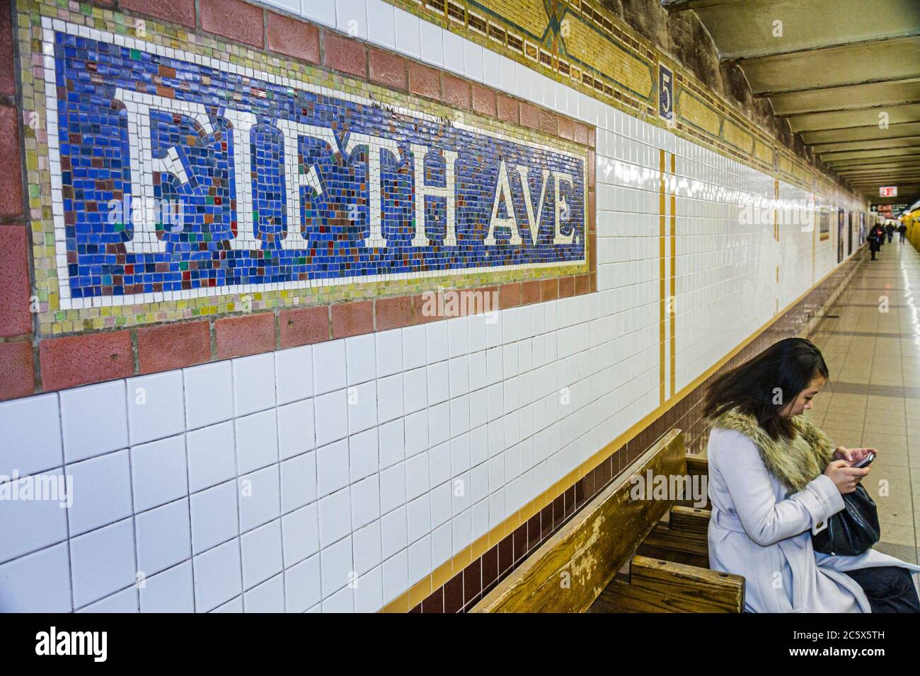 New York,New York City,NYC,Manhattan,Midtown,MTA New York Subway system,5th Fifth Avenue Station,N R Q highway Route,waiting platform,name tablet,mosa Stock Photo
