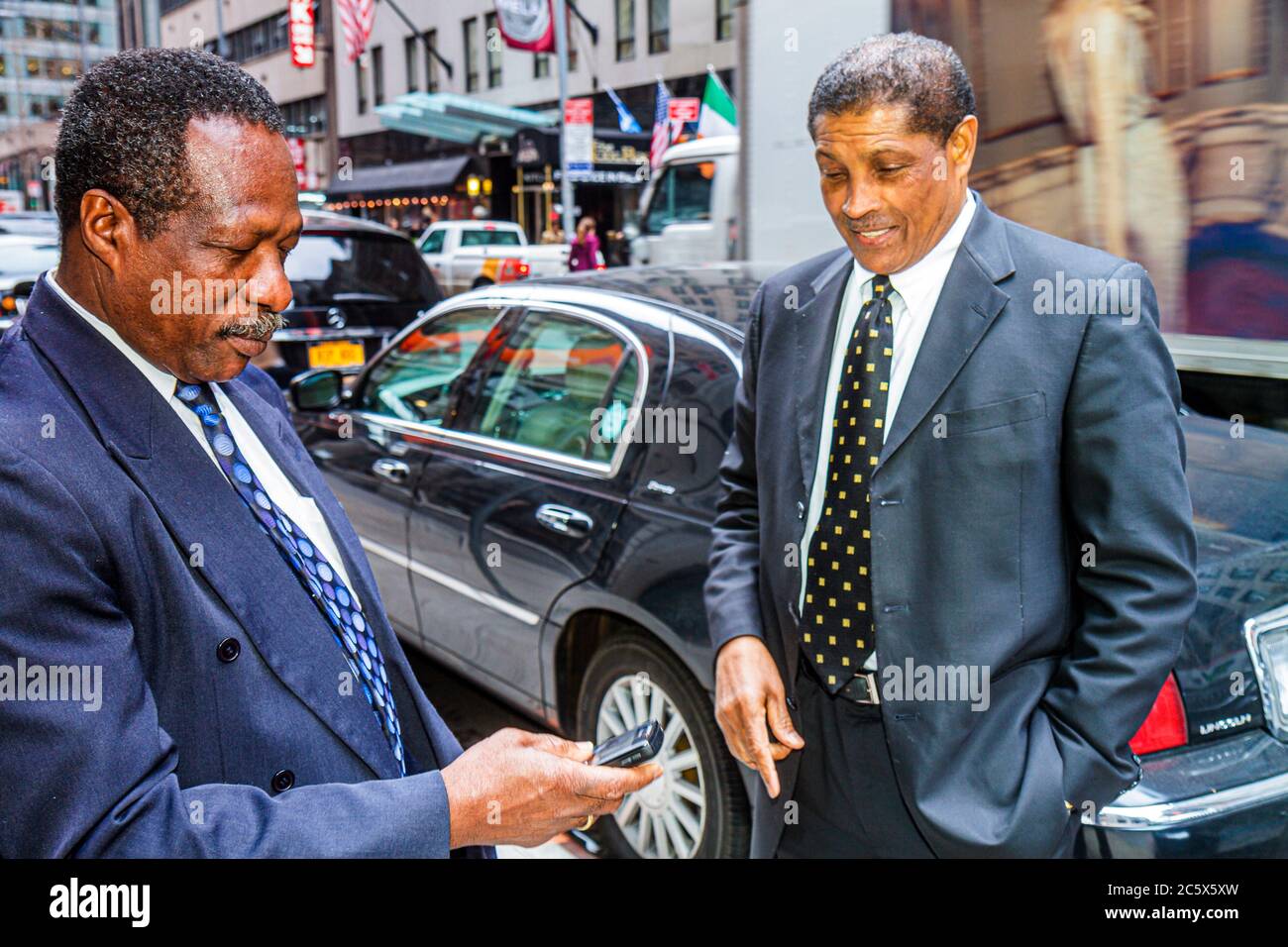 New York,New York City,NYC,Manhattan,Midtown,44th Street,chauffeur,driver,limousine,car cars service,Black Blacks African Africans ethnic minority,man Stock Photo