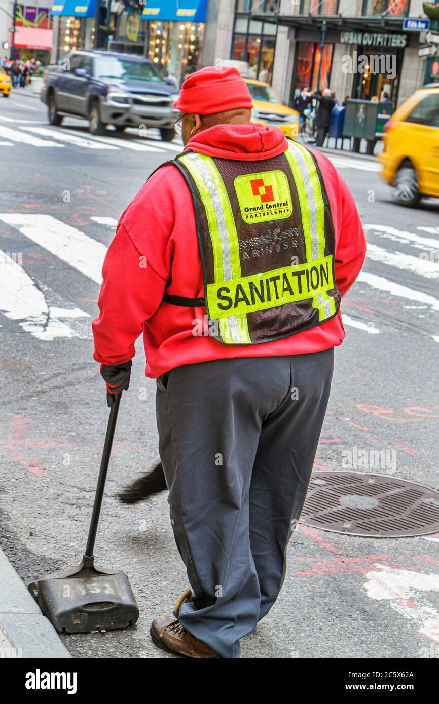 New York City,NY NYC Manhattan,Midtown,Times Square,Grand Central Partnership,Improvement District,BID,Black man men male adult adults,sanitation,work Stock Photo