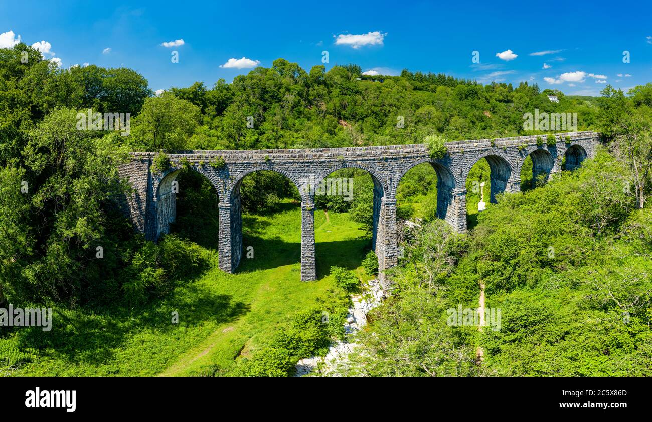 Panoramic aerial view of an old Victorian era viaduct in a beautiful, green rural setting (Pontsarn, Wales, UK) Stock Photo