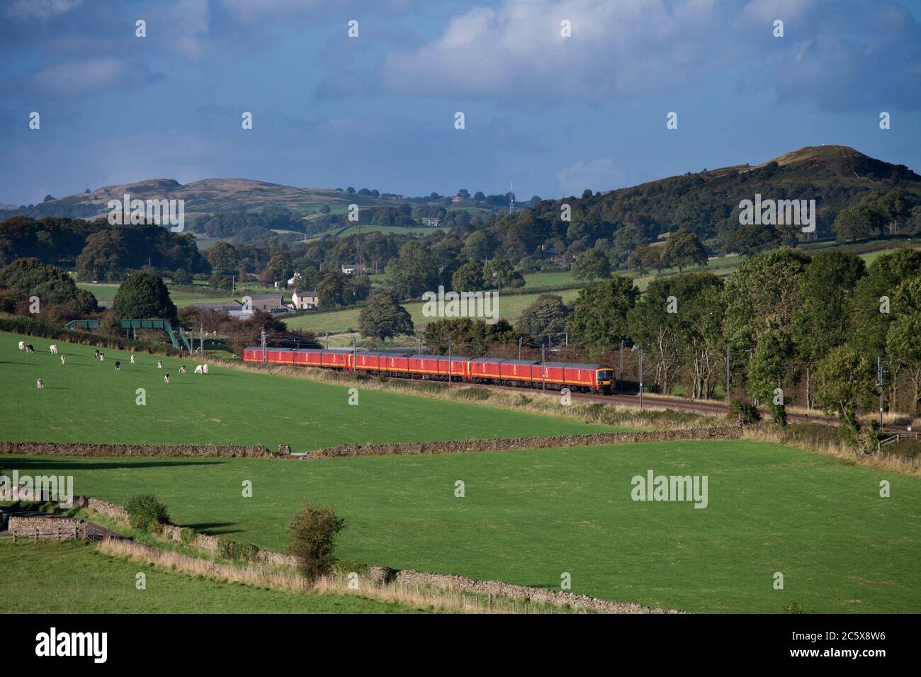 3 Royal Mail class 325 postal trains pass Wellheads, Cumbria on the west coast main line with the 1616 Shieldmuir - Warrington Dallam mail Stock Photo