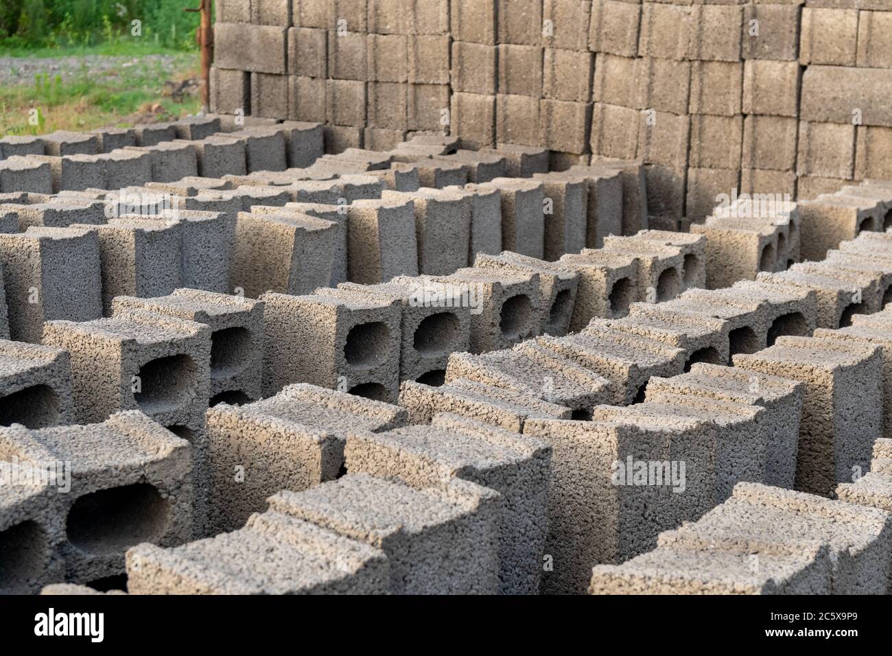 stacks of gray concrete blocks on the ground Stock Photo Alamy