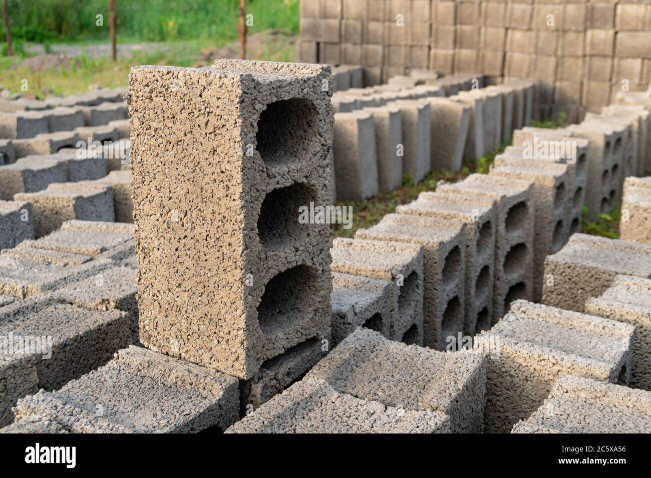 stacks of gray concrete blocks on the ground Stock Photo Alamy