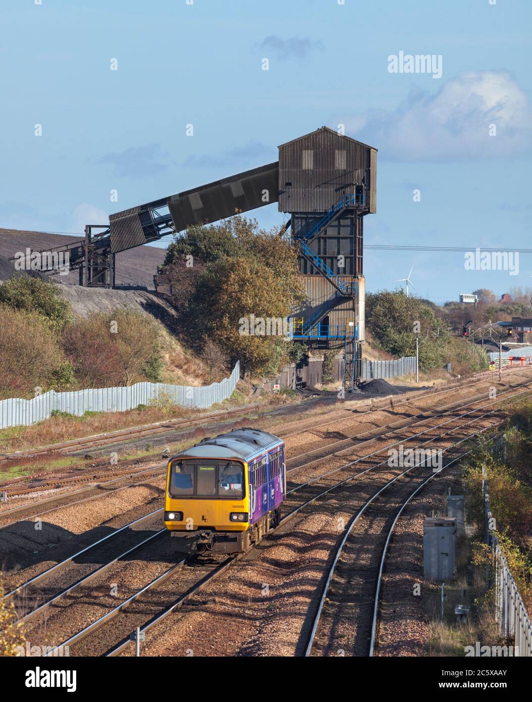 Northern Rail class 144 pacer train 144003 passing the closed Hatfield colliery, Yorkshire, UK Stock Photo
