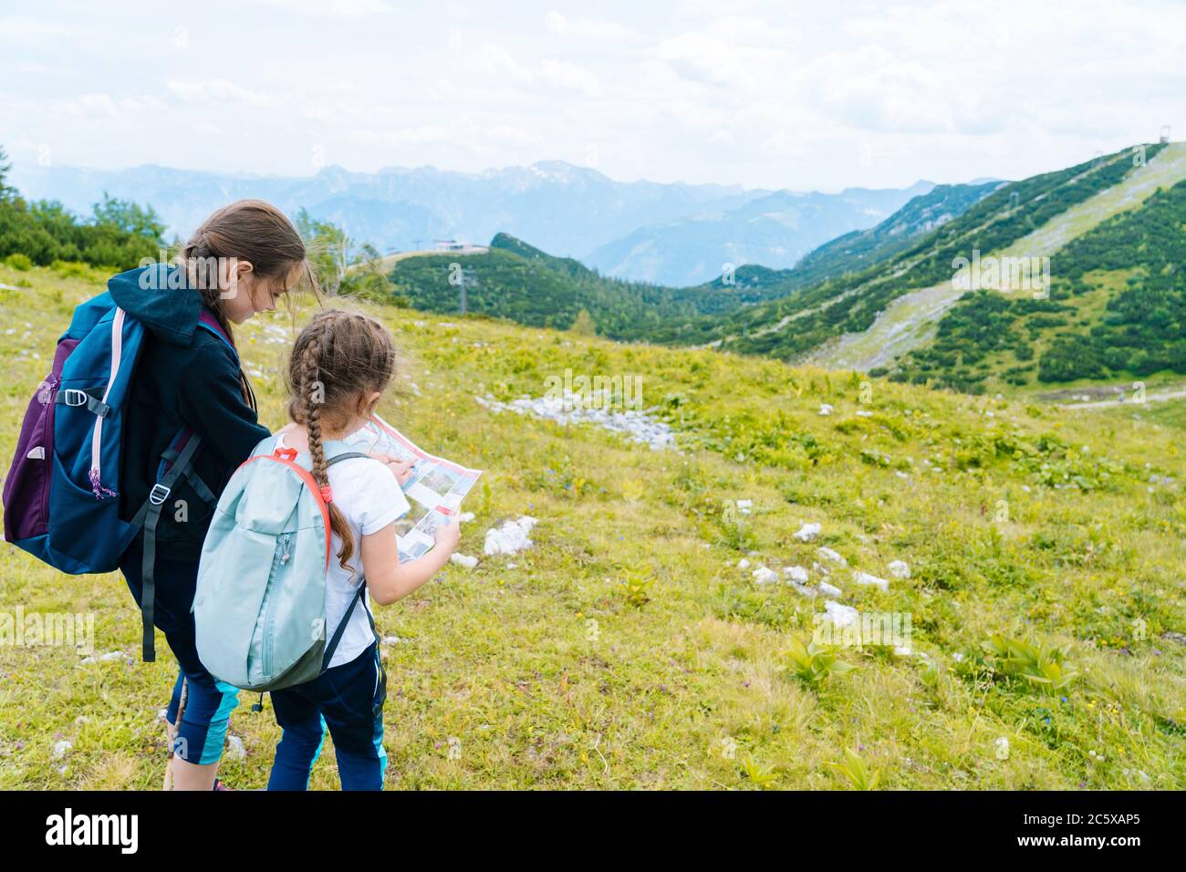 Children hiking on beautiful summer day in alps mountains Austria ...