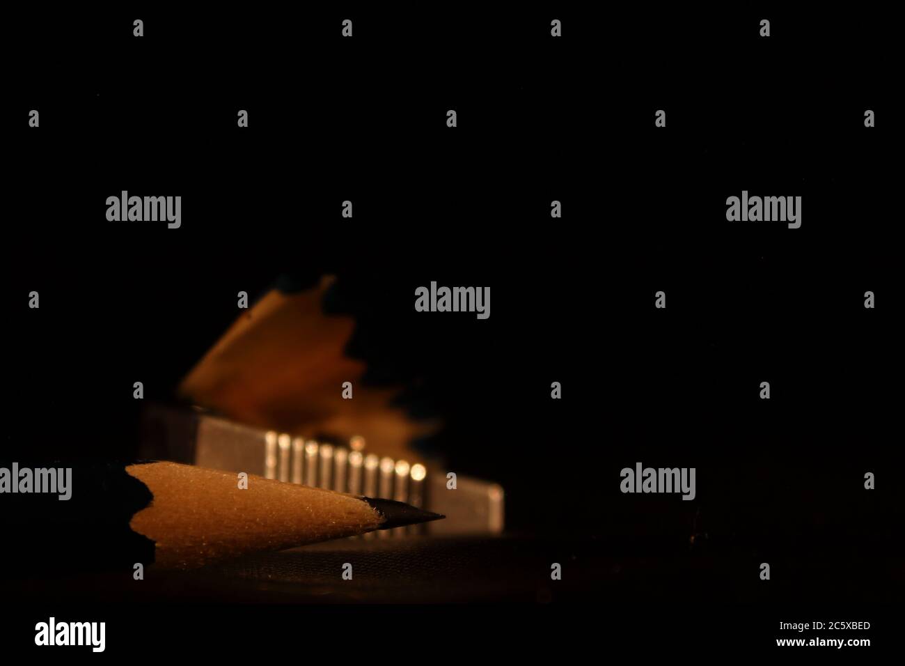 pencil tip on a black background with sharpener detail Stock Photo