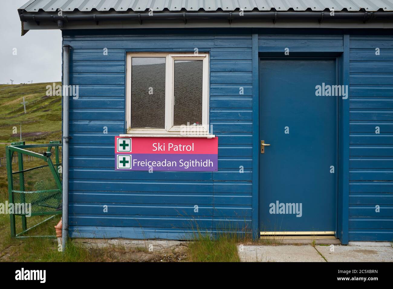 Waiting for winter, during a rainy July and out of season, the Ski Patrol and First Aid Centre is closed at the Lecht Ski Centre Stock Photo