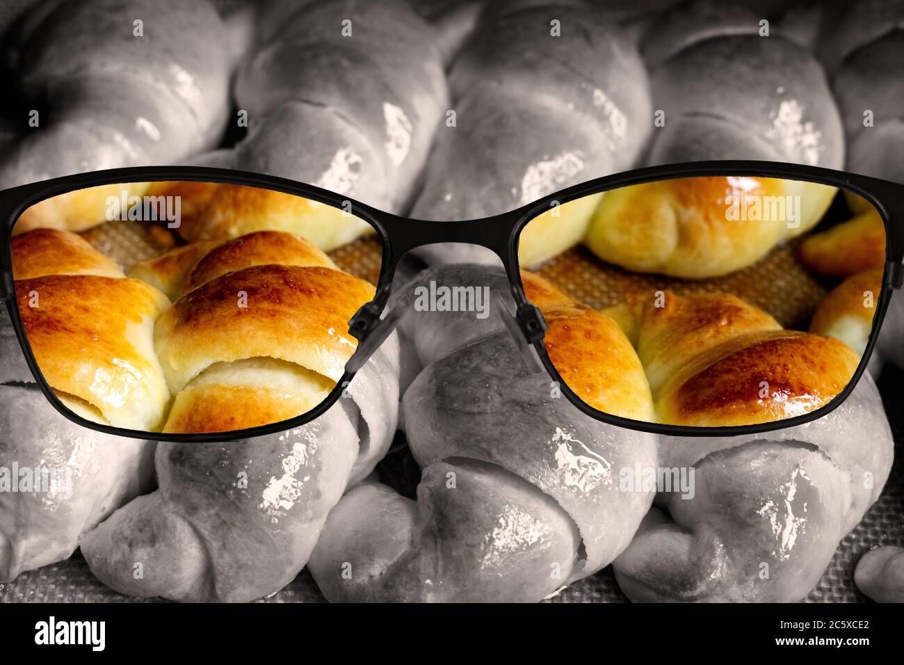 View of croissants through lens, medialunas de Manteca in selective colors. Stock Photo