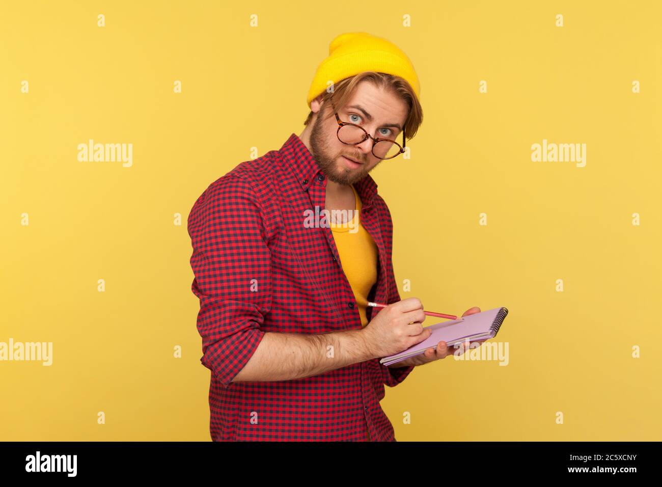 Hipster nerd guy in beanie hat and 