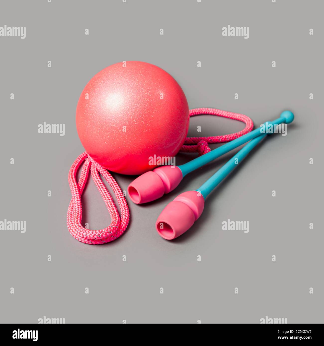 Gymnastic equipment. Skipping rope, clubs for rhythmic gymnastics and ball  Stock Photo - Alamy
