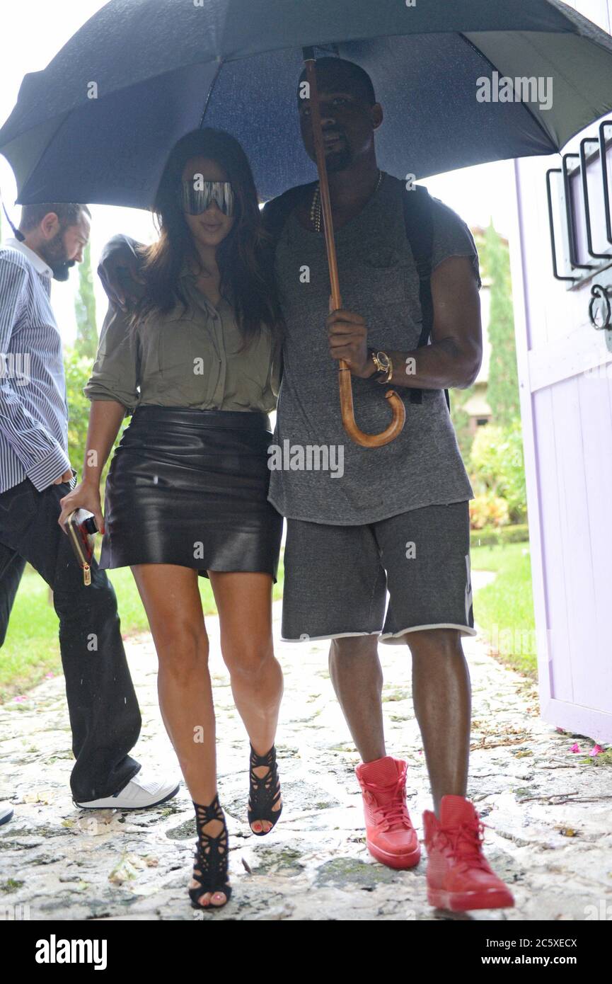 Miami, United States Of America. 09th Oct, 2012. MIAMI, FL - OCTOBER 08: Kim Kardashian is said to be devastated that her ex, Reggie Bush is expecting a baby with his girlfriend, Lilit Avagyan She was seen today walking in the rain hand and hand in Miami house hunting with boyfriend Kanye West . on October 8, 2012 in Miami, Florida. People: Kim Kardashian, Kanye West Credit: Storms Media Group/Alamy Live News Stock Photo