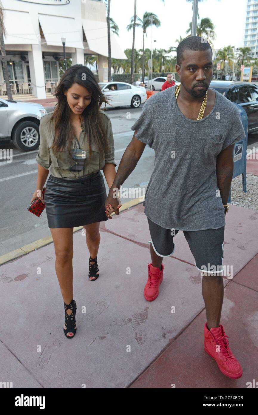 Miami, United States Of America. 09th Oct, 2012. MIAMI, FL - OCTOBER 08: Kim Kardashian is said to be devastated that her ex, Reggie Bush is expecting a baby with his girlfriend, Lilit Avagyan She was seen today walking in the rain hand and hand in Miami house hunting with boyfriend Kanye West . on October 8, 2012 in Miami, Florida. People: Kim Kardashian, Kanye West Credit: Storms Media Group/Alamy Live News Stock Photo
