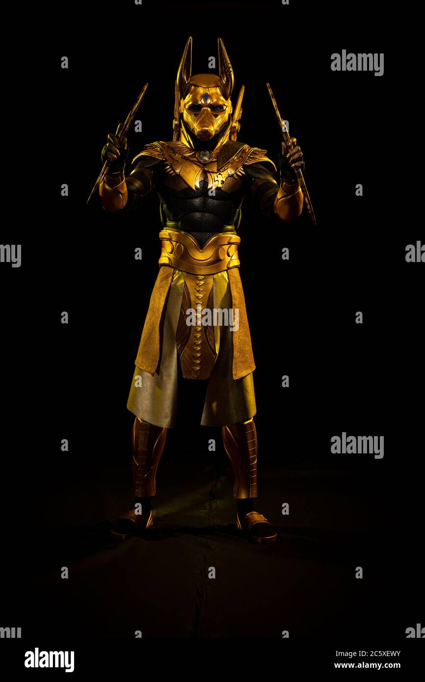 a male actor in a suit of an Egyptian mythology character, the golden ...