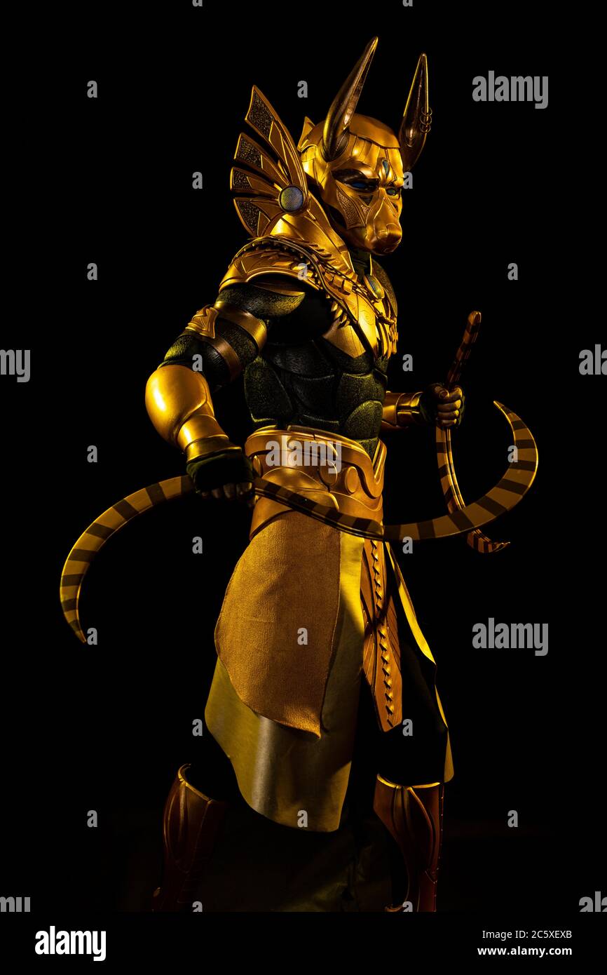 a male actor in a suit of an Egyptian mythology character, the golden ...