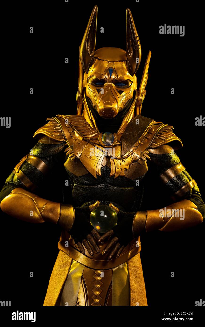 a male actor in a suit of an Egyptian mythology character, the golden ...