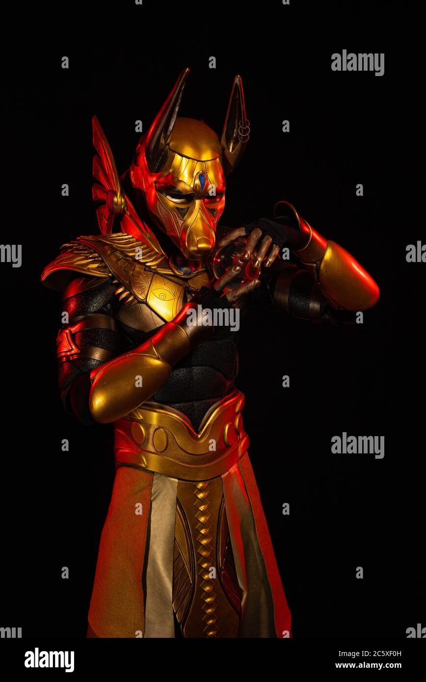a male actor in a suit of an Egyptian mythology character, the golden ...