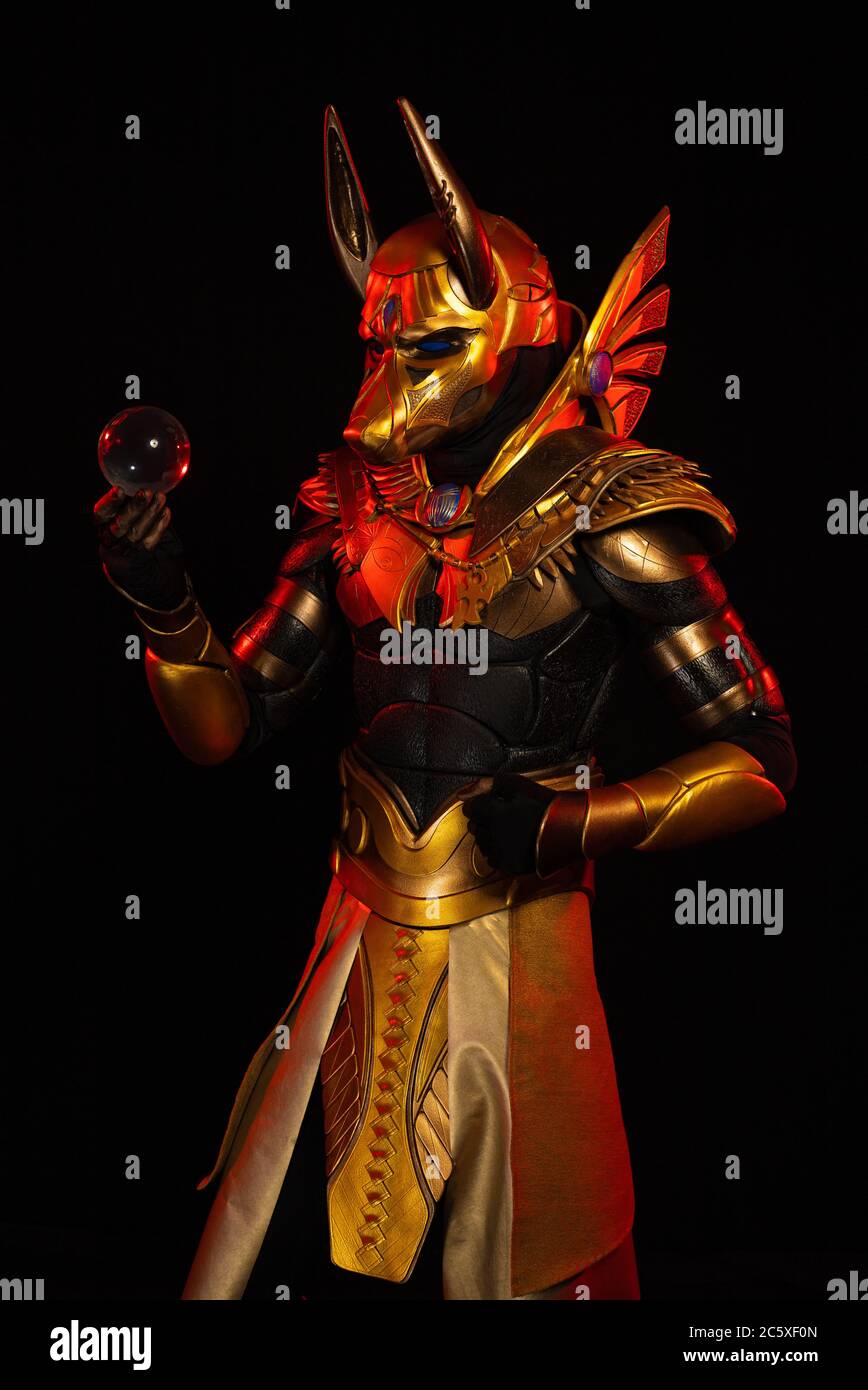 a male actor in a suit of an Egyptian mythology character, the golden ...