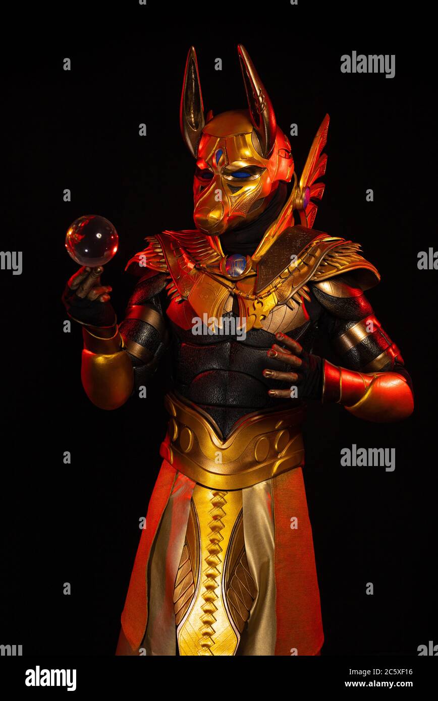 a male actor in a suit of an Egyptian mythology character, the golden ...