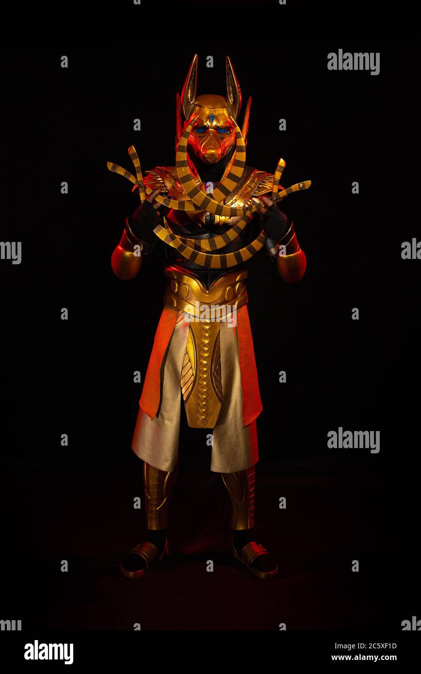 a male actor in a suit of an Egyptian mythology character, the golden ...